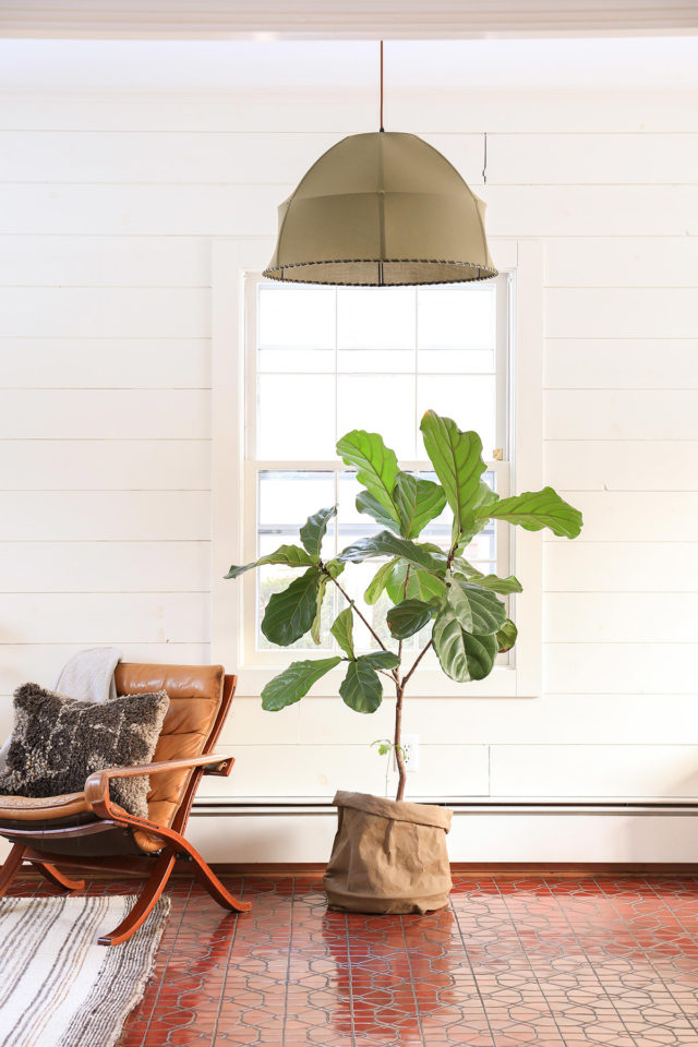 room with wicker lamp and chair