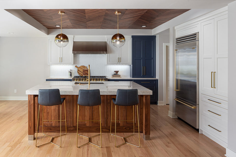 kitchen island with cabinetry with a mitered edge, homes that rock